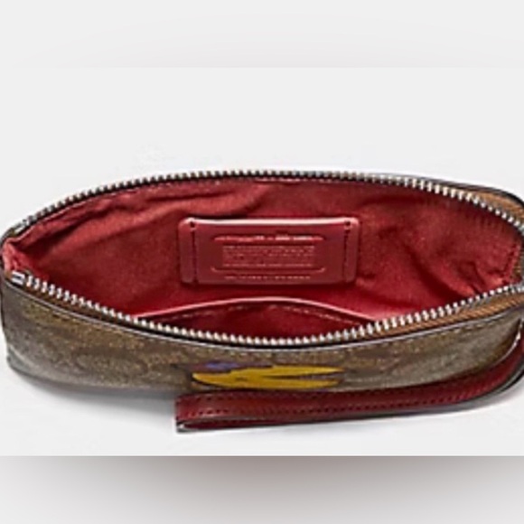 COACH CORNER ZIP WRISTLET IN SIGNATURE CANVAS WITH MS. PAC-MAN - Picture 2 of 2